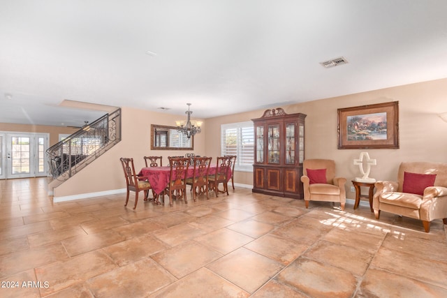 dining room with a notable chandelier