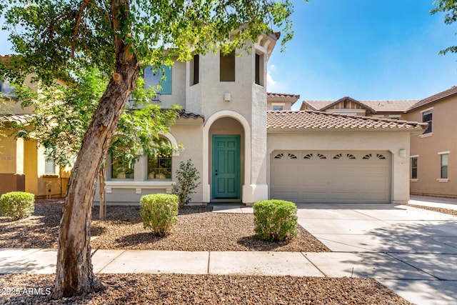 3875 E Claxton Ave, Gilbert, AZ 85297 - mediterranean / spanish home featuring a garage, driveway, a tiled roof, and stucco siding