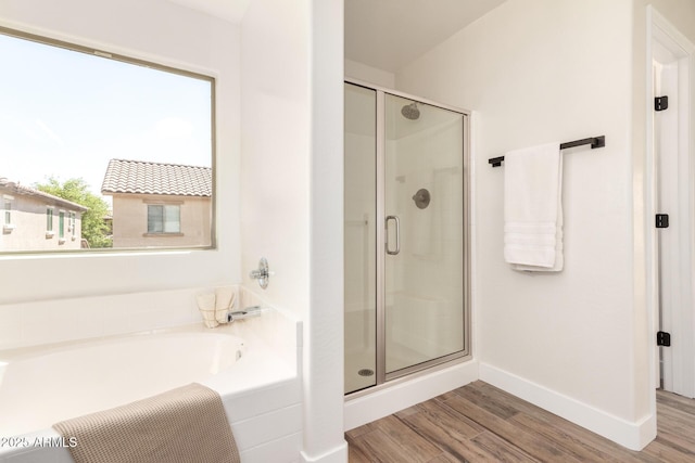 3875 E Claxton Ave, Gilbert, AZ 85297 - full bath featuring a shower stall, wood finished floors, a garden tub, and baseboards
