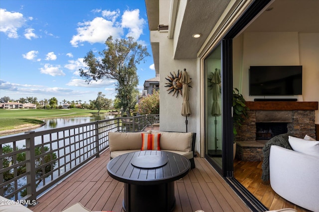 7272 E Gainey Ranch Rd Unit 29, Scottsdale, AZ 85258 - balcony with a water view and an outdoor stone fireplace