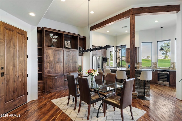 7272 E Gainey Ranch Rd Unit 29, Scottsdale, AZ 85258 - dining space featuring beverage cooler, healthy amount of natural light, dark wood finished floors, and recessed lighting