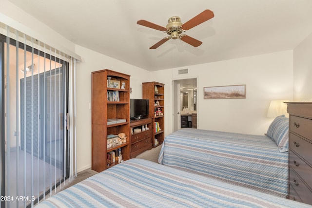 bedroom featuring ensuite bathroom, carpet floors, and ceiling fan