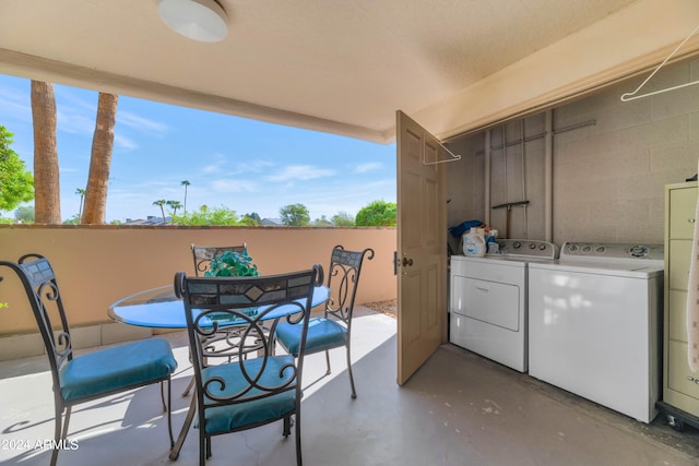 view of patio with washer and clothes dryer