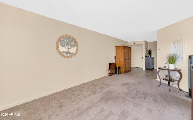 unfurnished room featuring carpet flooring