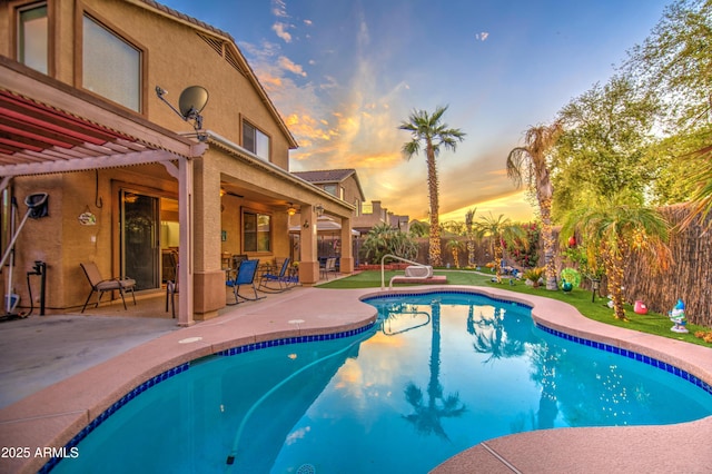 view of pool with a fenced in pool, ceiling fan, and a patio