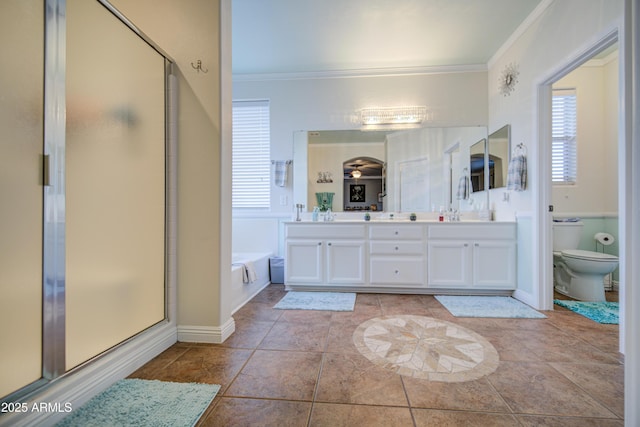 bathroom with toilet, a bath, crown molding, and a shower stall