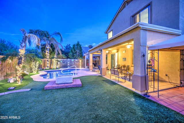 exterior space with a fenced backyard, a fenced in pool, a lawn, and a patio area