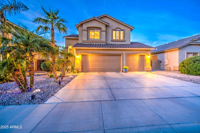 view of front facade featuring fence, a garage, concrete driveway, a tile roof, and stucco siding