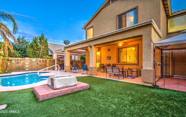 view of swimming pool featuring a fenced backyard, a yard, a patio, and a fenced in pool