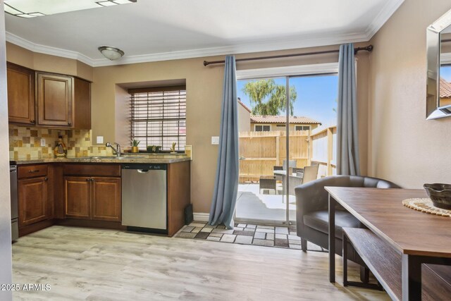 4601 N 102nd Ave Unit 1055, Phoenix, AZ 85037 - kitchen featuring stainless steel dishwasher, crown molding, light wood-style flooring, a sink, and stone counters
