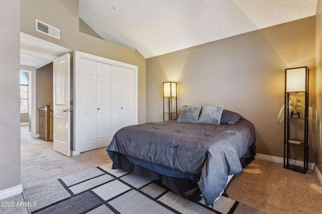 4601 N 102nd Ave Unit 1055, Phoenix, AZ 85037 - bedroom featuring vaulted ceiling, light colored carpet, baseboards, and a closet