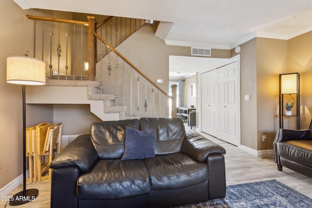 4601 N 102nd Ave Unit 1055, Phoenix, AZ 85037 - living area with wood finished floors, stairs, ornamental molding, and baseboards