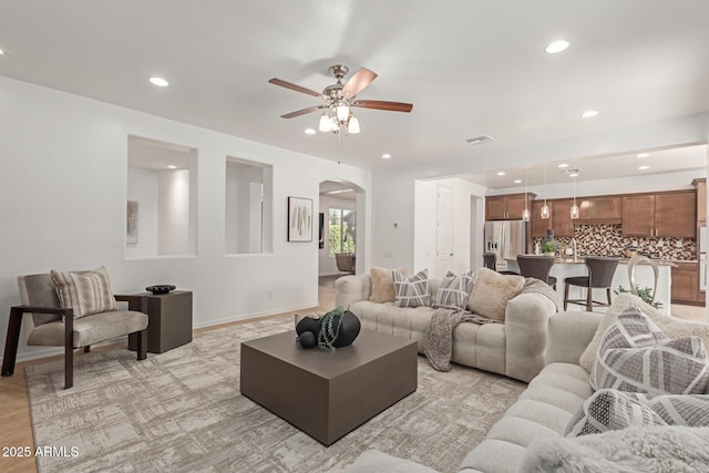 living room featuring ceiling fan