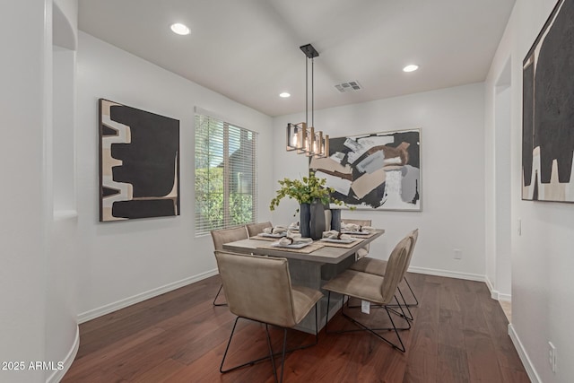 dining area with dark wood-type flooring