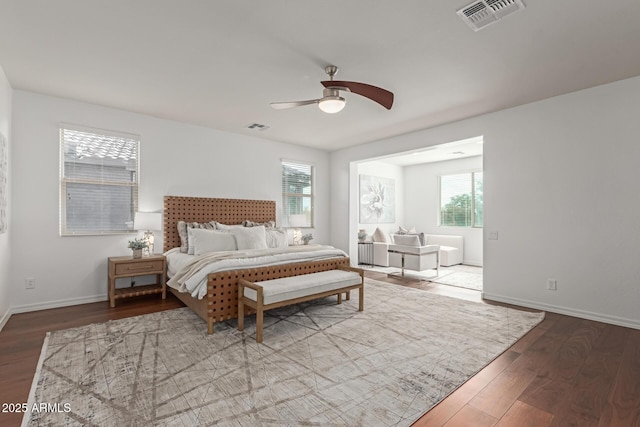 bedroom with ceiling fan and wood-type flooring