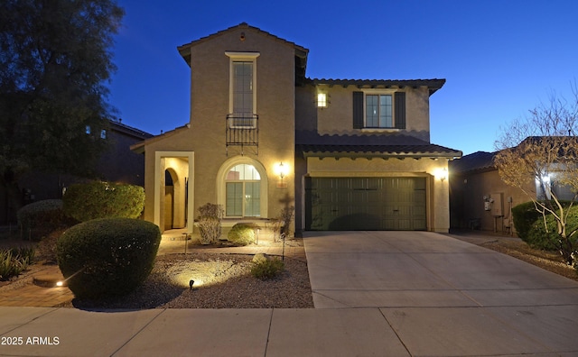 mediterranean / spanish-style home featuring a garage