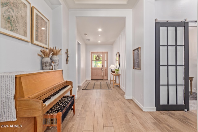 foyer entrance with light hardwood / wood-style flooring