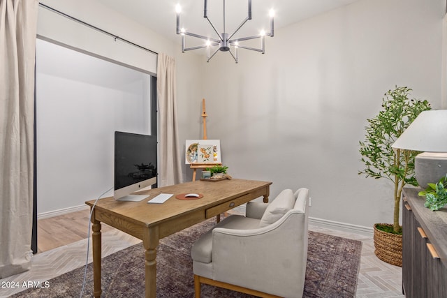 office area with light parquet flooring and a chandelier