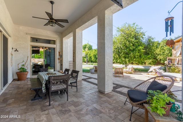 view of patio / terrace featuring ceiling fan and an outdoor living space