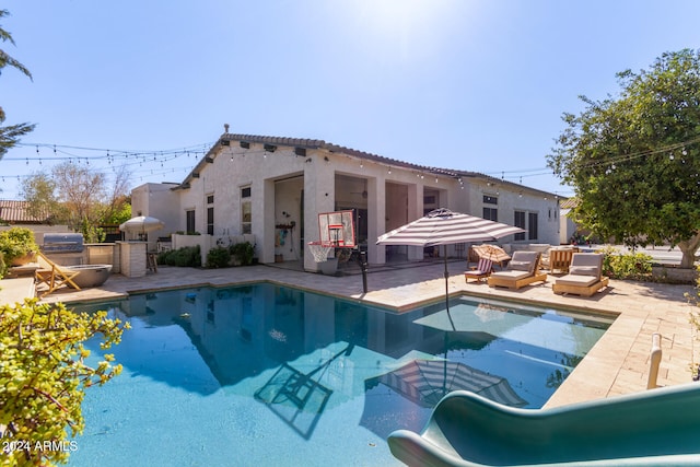 view of pool with a patio and an outdoor hangout area