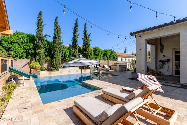 view of swimming pool with a patio