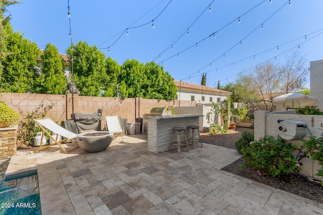 view of patio / terrace with exterior bar and grilling area