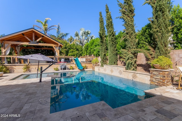 view of pool featuring a patio and a gazebo