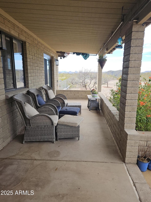 view of patio with a mountain view