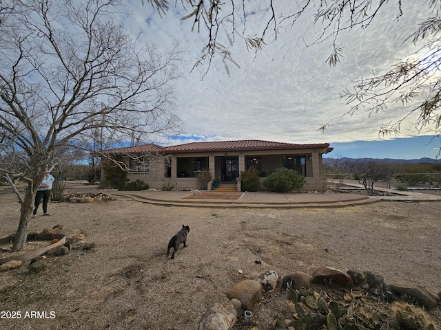 view of front of house with a patio area