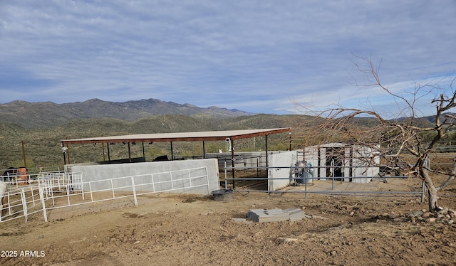 exterior space with a rural view and a mountain view