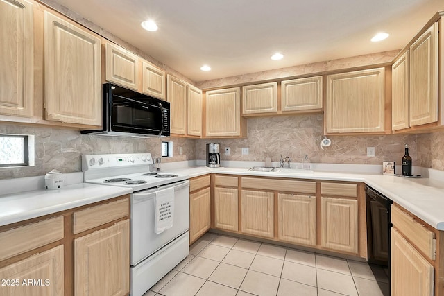 kitchen with a sink, backsplash, black appliances, and light brown cabinetry