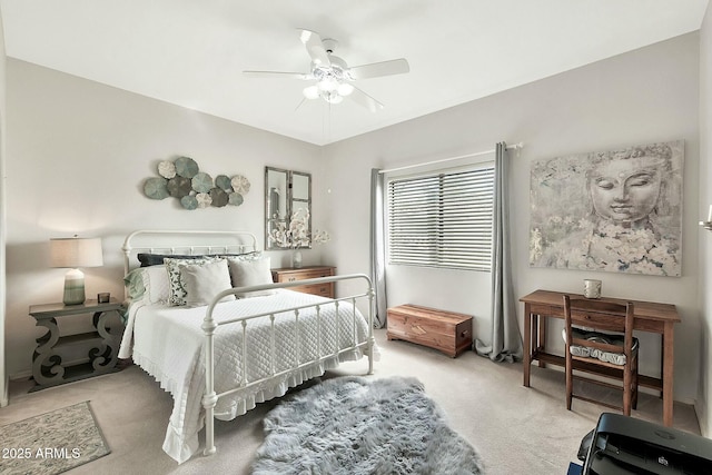 bedroom with a ceiling fan and carpet