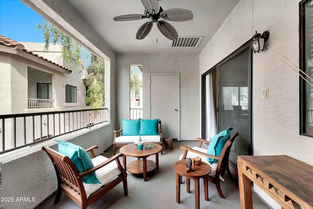 balcony with outdoor lounge area, a ceiling fan, and visible vents