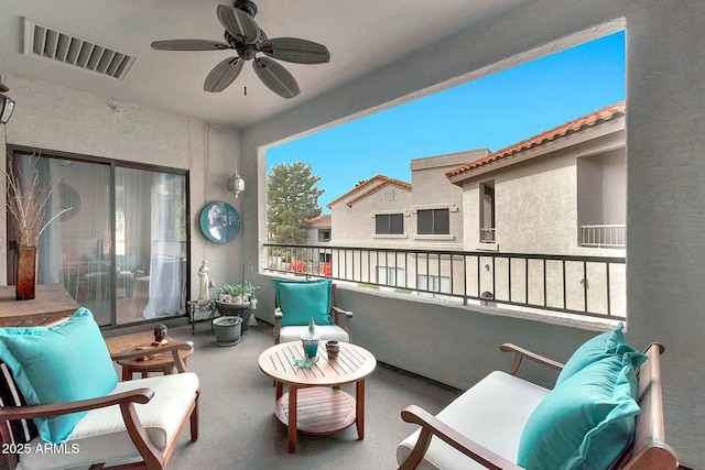 balcony with visible vents and ceiling fan