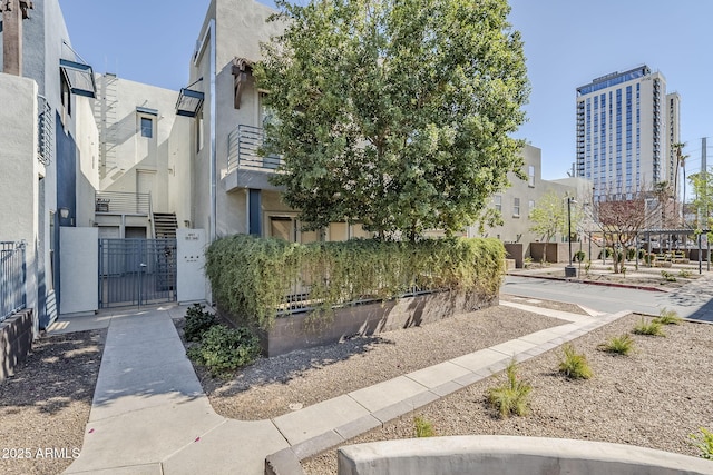 view of community with a gate and a city view