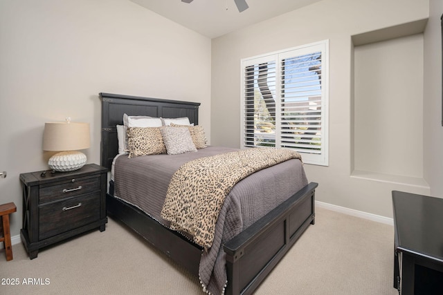 bedroom with ceiling fan and light colored carpet