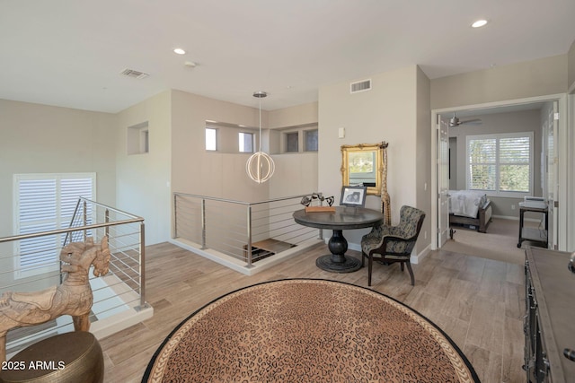 hall with light hardwood / wood-style flooring