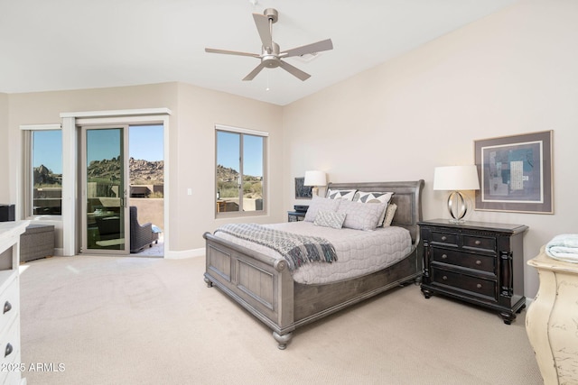 carpeted bedroom with ceiling fan and access to outside