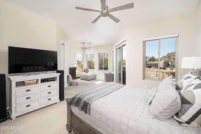 bedroom with ceiling fan, access to exterior, and light colored carpet