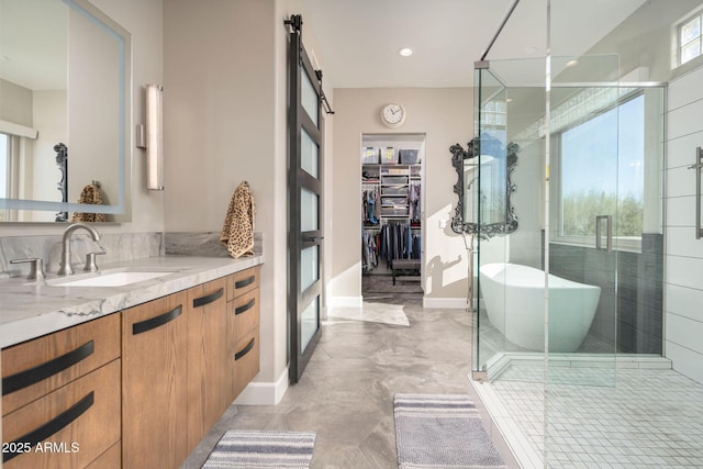 bathroom with vanity and independent shower and bath