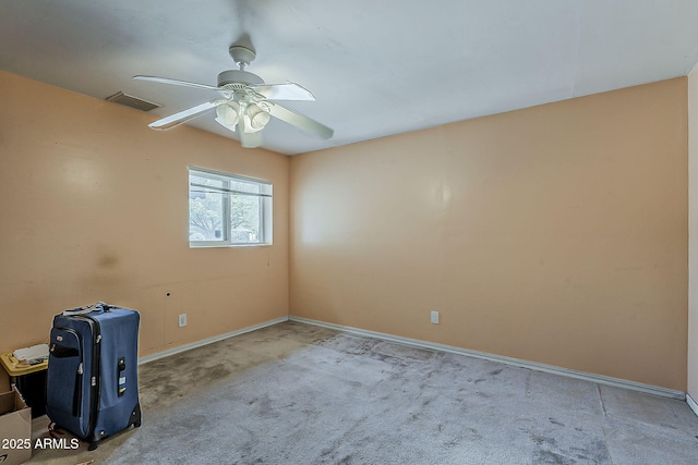 spare room featuring visible vents, baseboards, ceiling fan, and carpet flooring