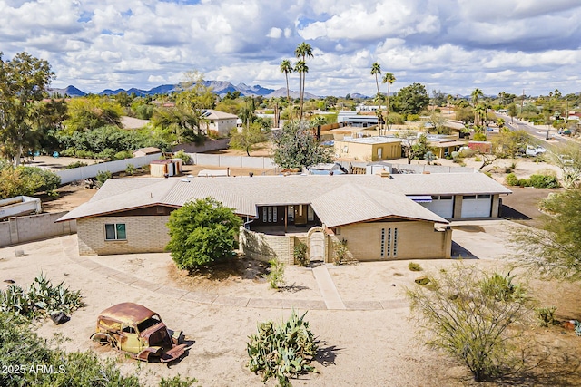 drone / aerial view featuring a mountain view