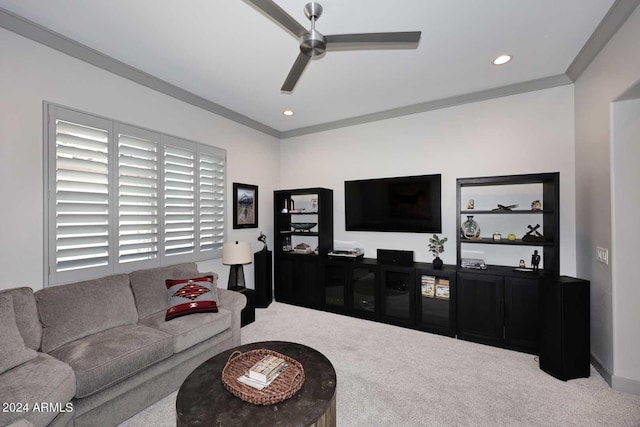 living room with carpet floors, ceiling fan, and ornamental molding