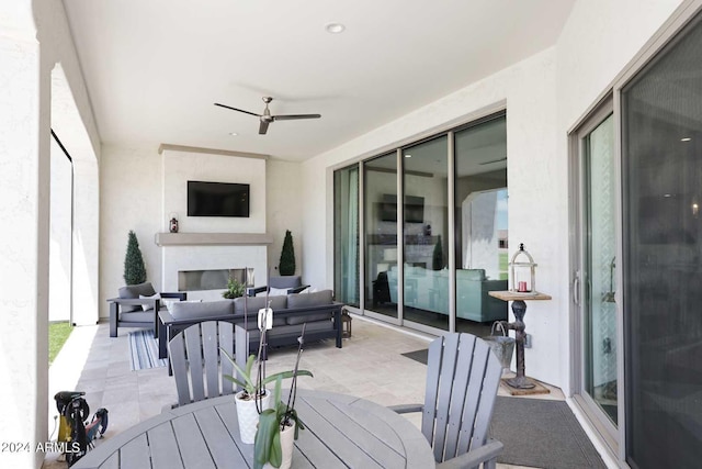 wooden deck with a patio, an outdoor hangout area, and ceiling fan