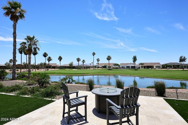 view of patio featuring a water view