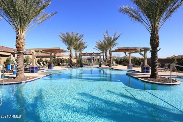 view of swimming pool featuring a pergola and a patio area