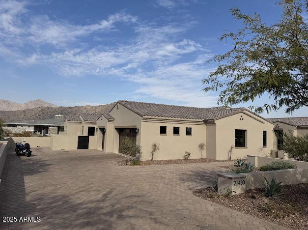 view of front of property with a mountain view