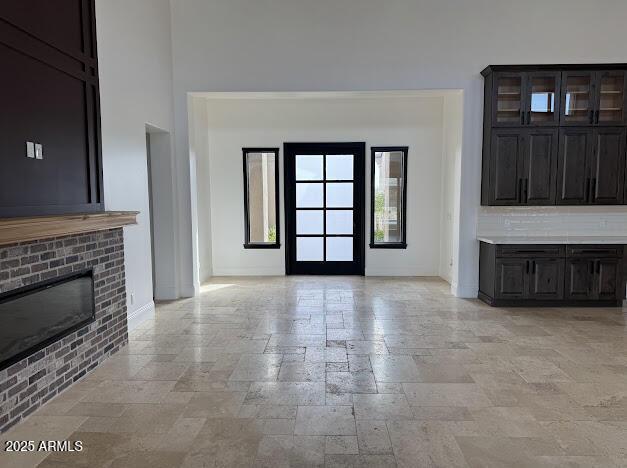 unfurnished living room with a fireplace