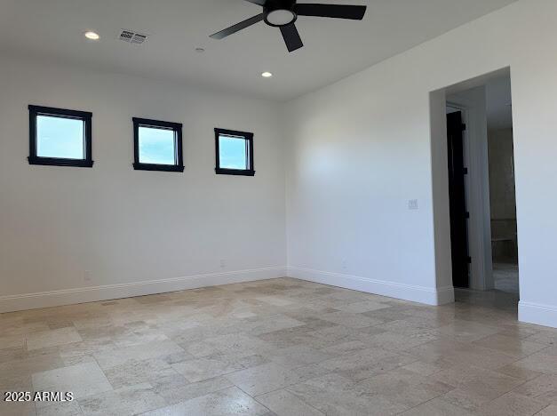 unfurnished room with ceiling fan