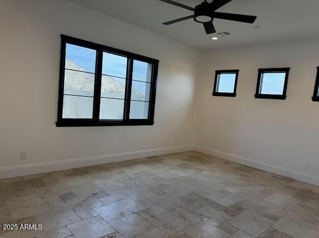 spare room with ceiling fan